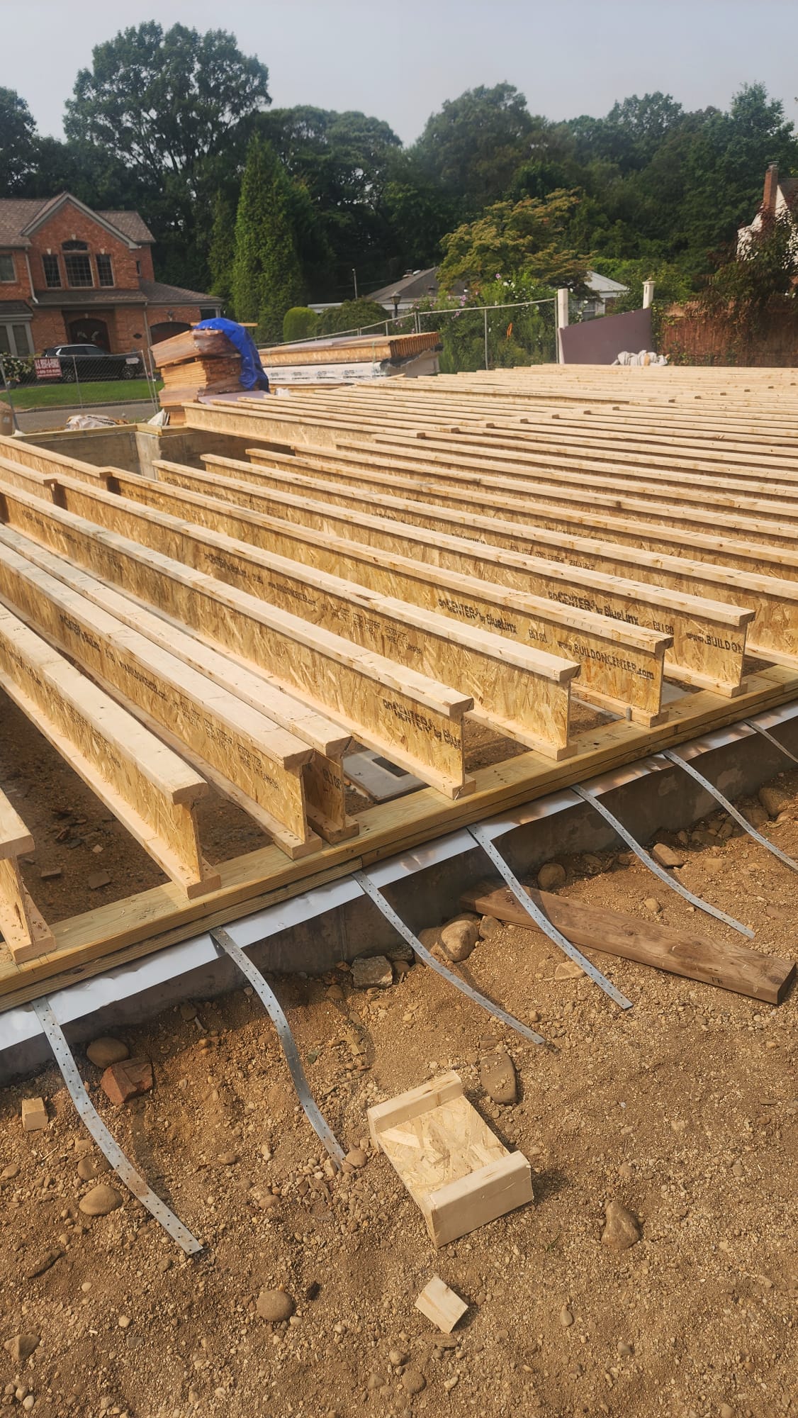 onCENTER engineered I-joists arranged across a residential foundation