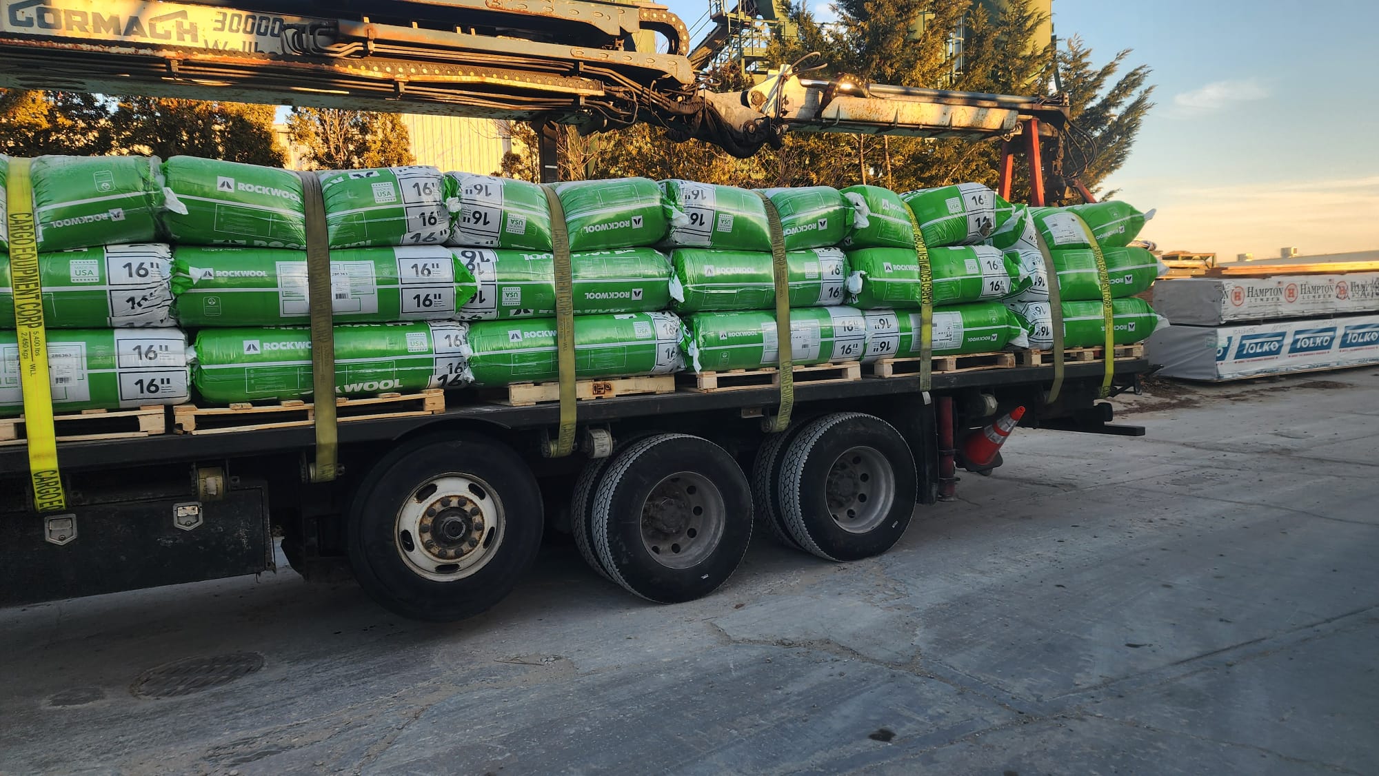 ROCKWOOL insulation bundles secured on a flatbed truck